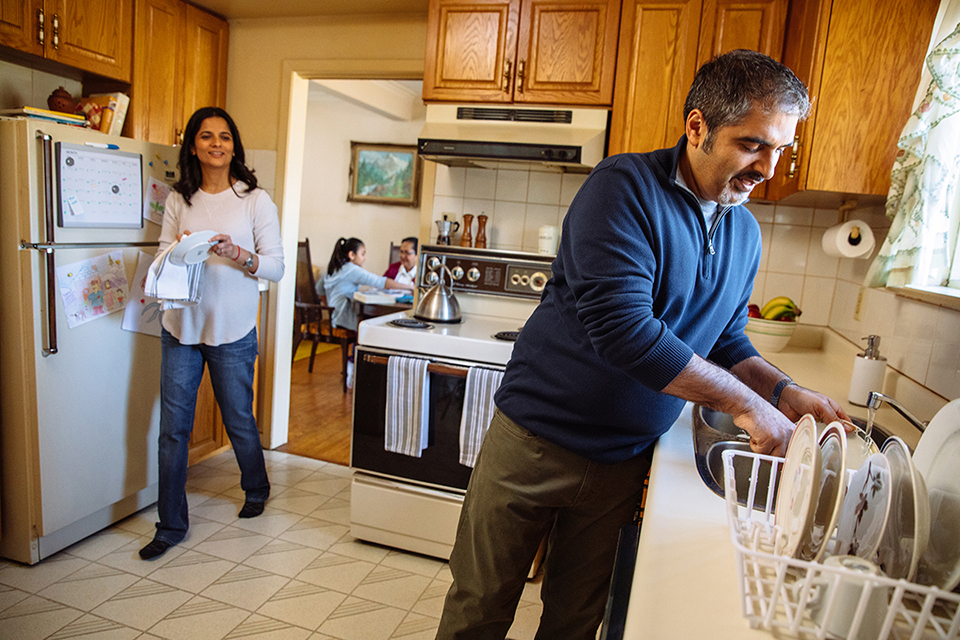 couple doing dishes in the kitchen
