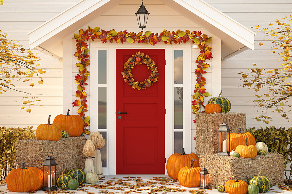 front entrance to single-family home decorated for autumn