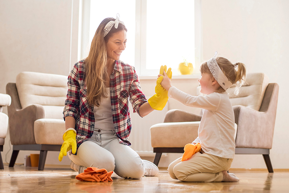 mother and daughter are cleaning to help reduce their allergies