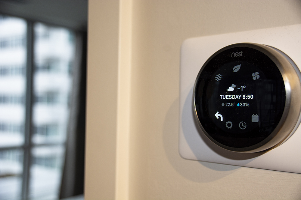 a smart thermostat giving a humidity reading